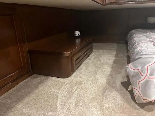 Slide: The Image of Cozy interior of 2010 Stardust Cruisers houseboat with bed and wooden furniture. - 26