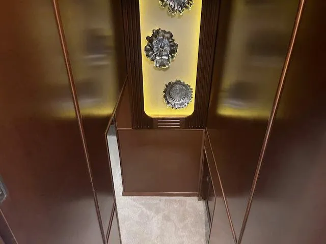 Slide: The Image of Interior of 2010 Stardust Cruisers houseboat with decorative wall art and wood paneling. - 28