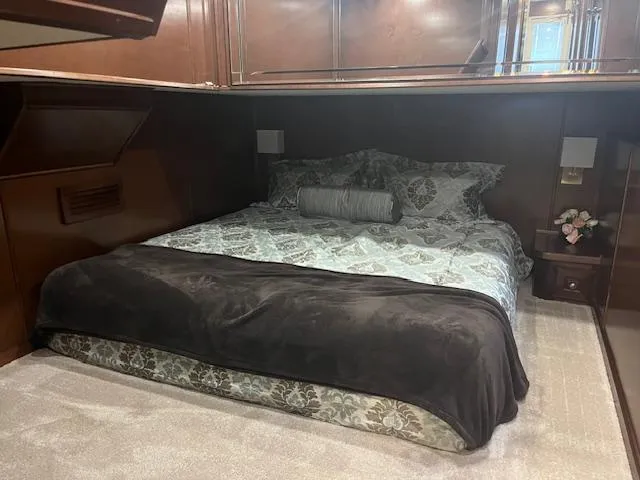 Slide: The Image of Luxurious bedroom interior of 2010 Stardust Cruisers houseboat with elegant bedding. - 30