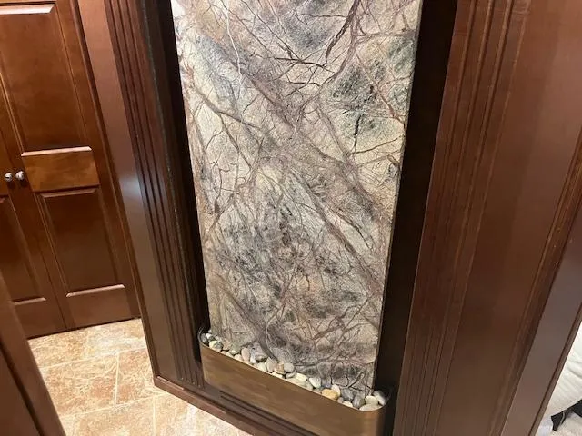 Slide: The Image of Luxurious interior of 2010 Stardust Cruisers houseboat with elegant stone wall feature. - 33