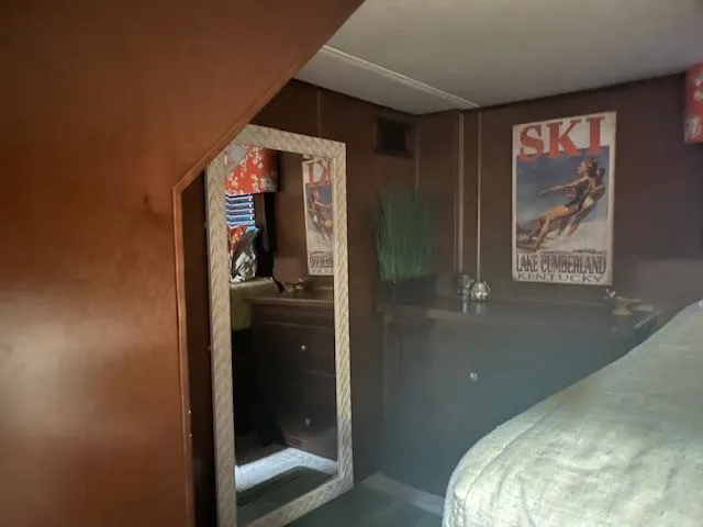 Slide: The Image of Cozy 2010 Stardust Cruisers houseboat interior with vintage ski poster and mirror. - 36