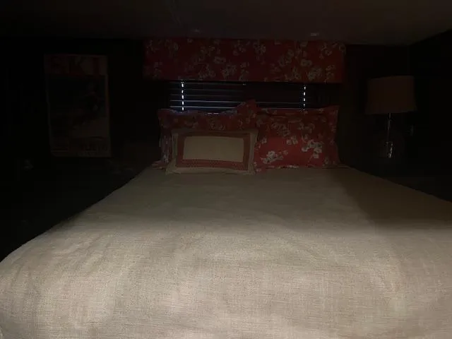 Slide: The Image of Cozy bedroom in 2010 Stardust Cruisers houseboat with floral decor and soft lighting. - 37