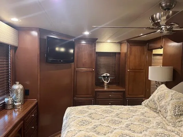 Slide: The Image of Luxurious 2010 Stardust Cruisers houseboat bedroom with wood cabinetry and modern decor. - 42
