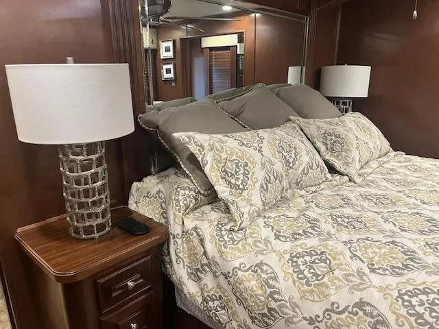 Slide: The Image of Luxurious bedroom interior of 2010 Stardust Cruisers houseboat with elegant bedding and lamps. - 43