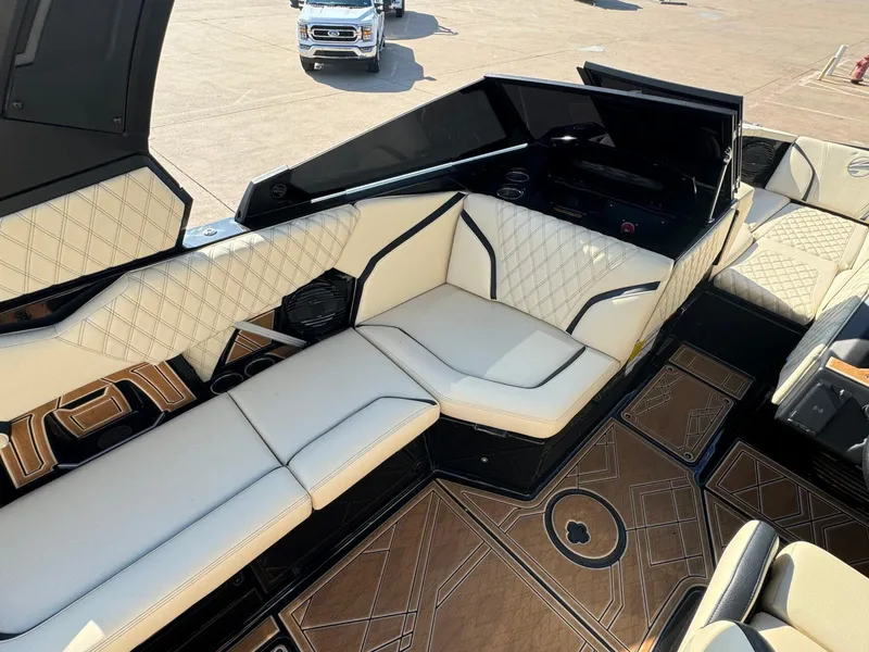 Slide: The Image of 2024 Tigé 24RZX boat interior with luxurious seating and stylish flooring. - 12