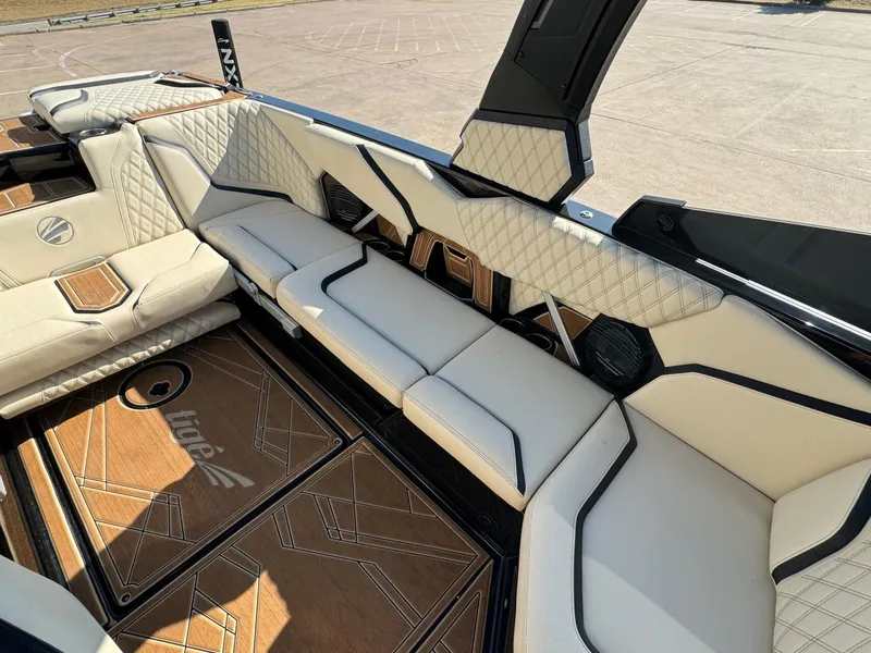 Slide: The Image of 2024 Tigé 24RZX boat interior with luxurious seating and stylish design. - 13