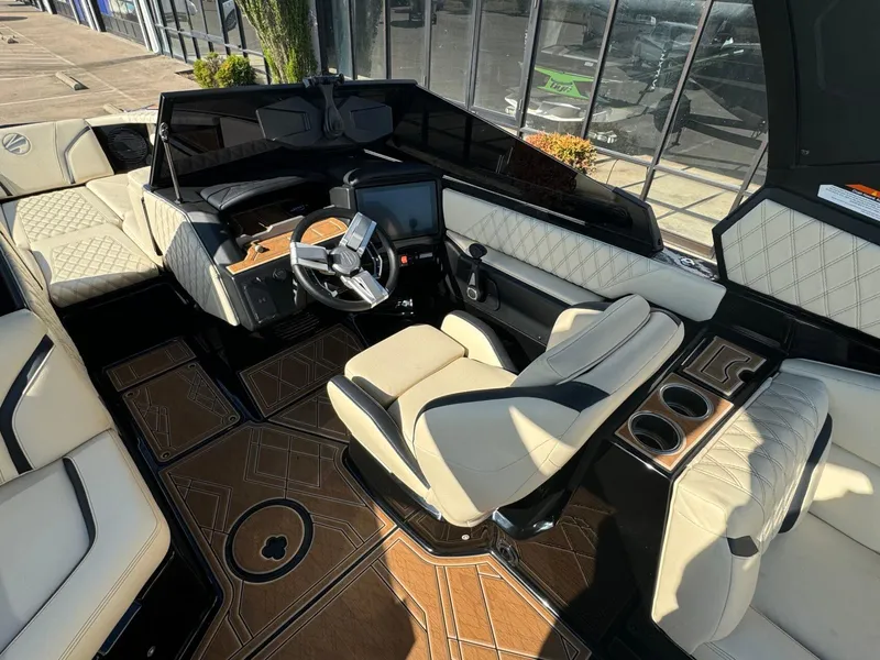 Slide: The Image of 2024 Tigé 24RZX boat interior with luxurious seating and modern dashboard design. - 14