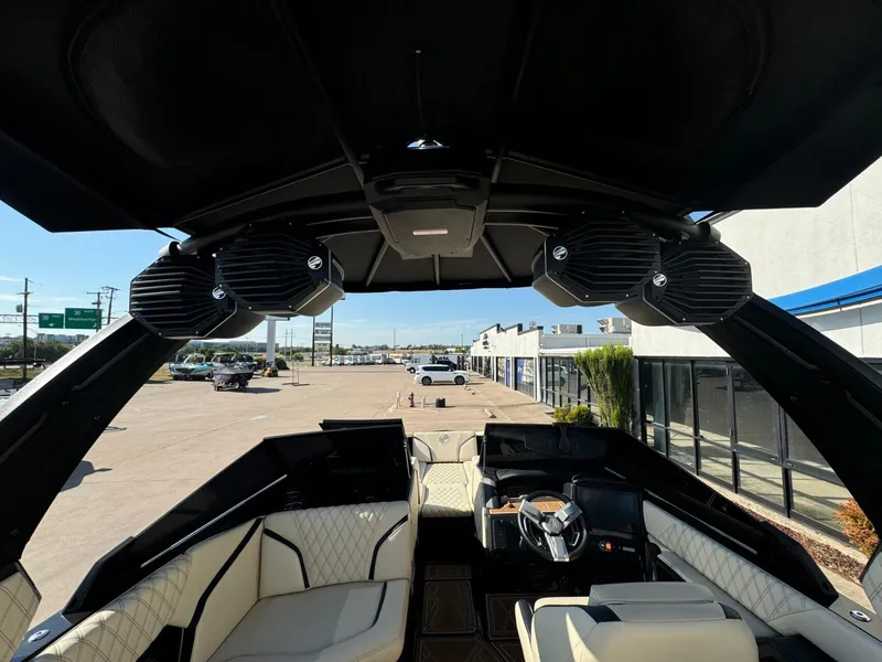 Slide: The Image of 2024 Tigé 24RZX boat interior with luxury seating and advanced audio system. - 16