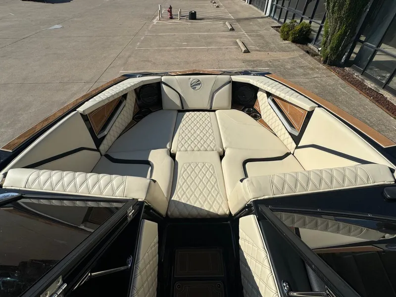 Slide: The Image of 2024 Tigé 24RZX boat interior with luxurious beige seating and diamond stitching. - 6