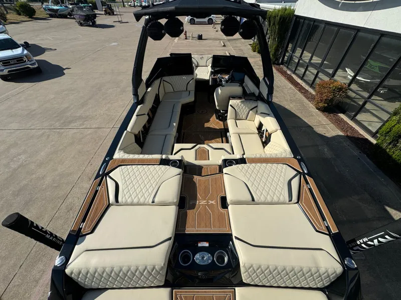 Slide: The Image of 2024 Tigé 24RZX boat with luxurious seating and modern design in a showroom setting. - 9