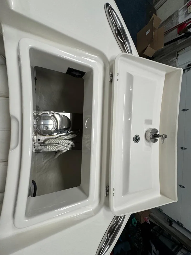 Slide: The Image of Open storage compartment on 2022 Regulator 25 boat. - 18