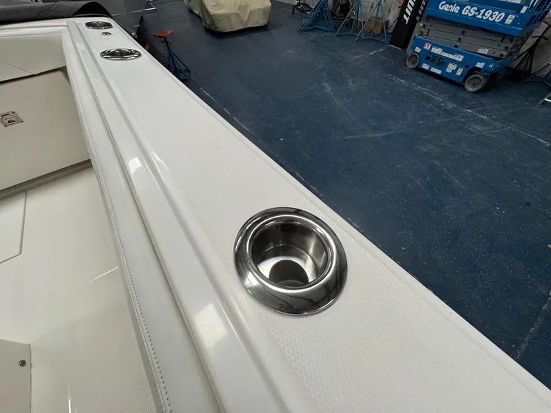 Slide: The Image of 2022 Regulator 25 boat with stainless steel cup holder on deck. - 26