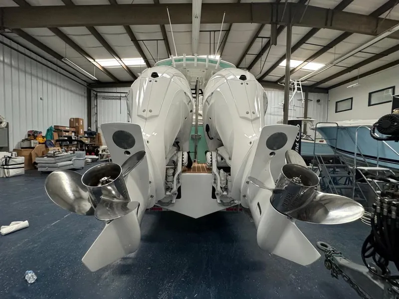 Slide: The Image of 2022 Regulator 25 boat engines in a storage facility. - 36