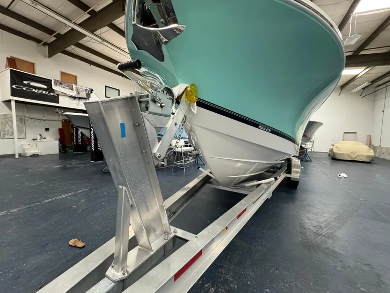 Slide: The Image of 2022 Regulator 25 boat on trailer in indoor storage facility. - 41