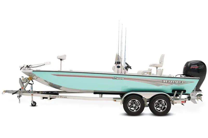 Slide: The Image of 2024 Ranger RB200 boat on trailer, parked outdoors with trees in background. - 5