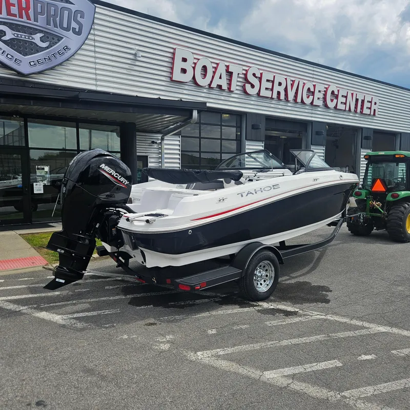 Slide: The Image of 2024 Tahoe 200 S boat on trailer at Boat Service Center. - 1