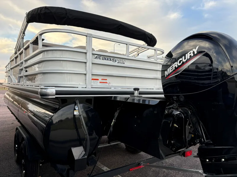 Slide: The Image of 2024 Ranger Reata 223FC pontoon boat with Mercury outboard motor. - 3