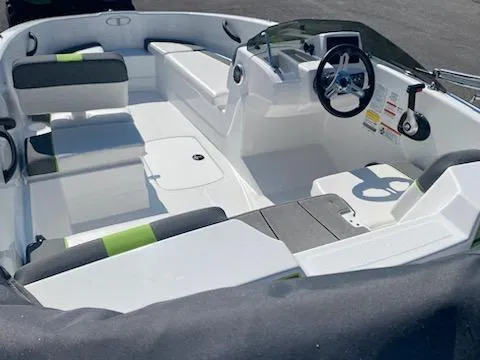 Slide: The Image of 2024 Tahoe T16 boat interior with modern seating and steering console. - 10