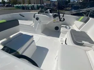Slide: The Image of 2024 Tahoe T16 boat interior with seating and steering wheel. - 13