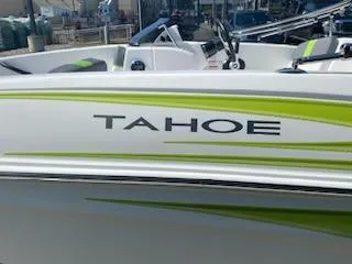 Slide: The Image of 2024 Tahoe T16 boat with green accents and sleek design. - 4