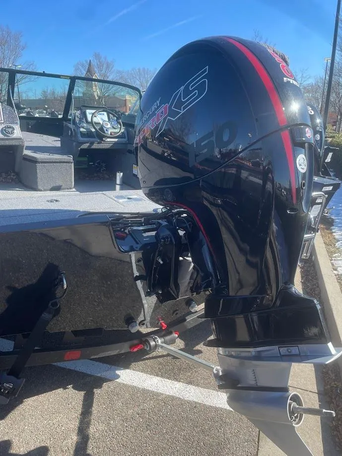 Slide: The Image of 2024 Ranger VS1782SC Angler boat with powerful outboard motor, parked outdoors. - 3