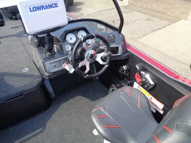 Slide: The Image of 2024 Nitro ZV20 Pro boat cockpit with steering wheel and Lowrance display. - 10