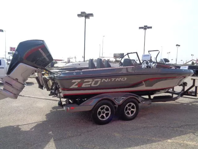 Slide: The Image of 2024 Nitro ZV20 Pro fishing boat on trailer in parking lot. - 3