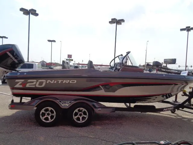 Slide: The Image of 2024 Nitro ZV20 Pro fishing boat on trailer in parking lot. - 4