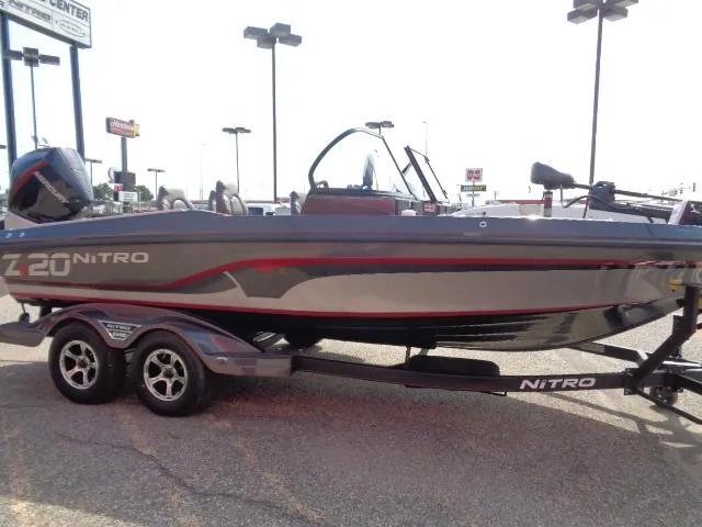 Slide: The Image of 2024 Nitro ZV20 Pro fishing boat on trailer in parking lot. - 5