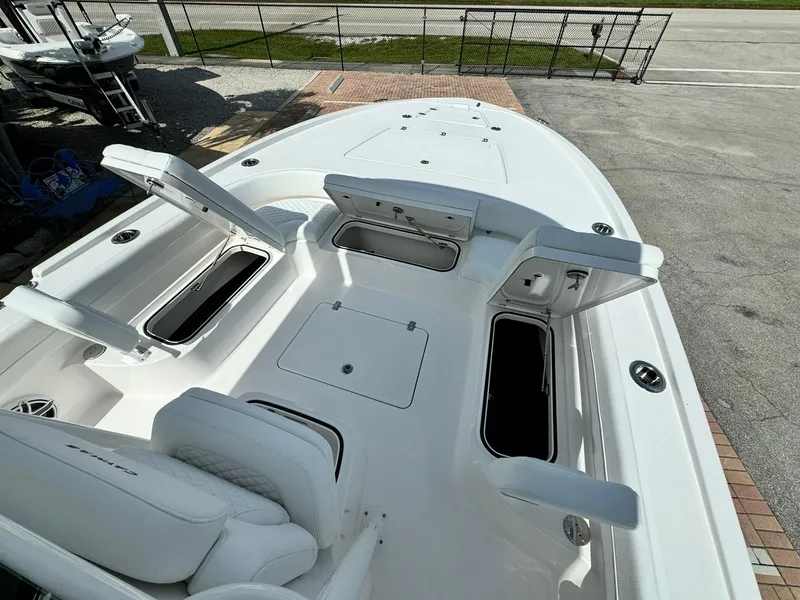 Slide: The Image of 2025 Caymas 281 HB boat deck with open storage compartments. - 12
