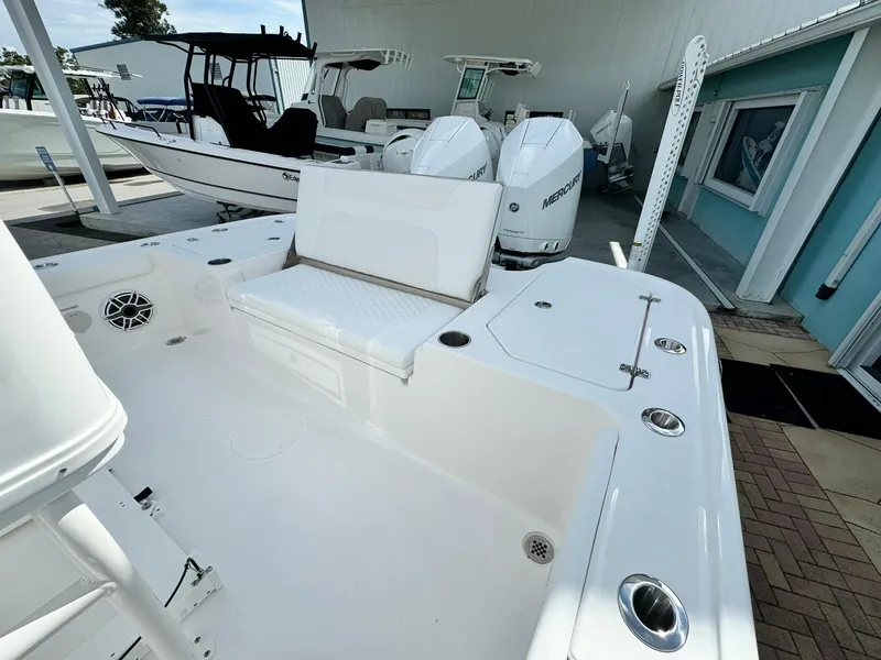 Slide: The Image of 2025 Caymas 281 HB boat with dual engines and spacious deck. - 6