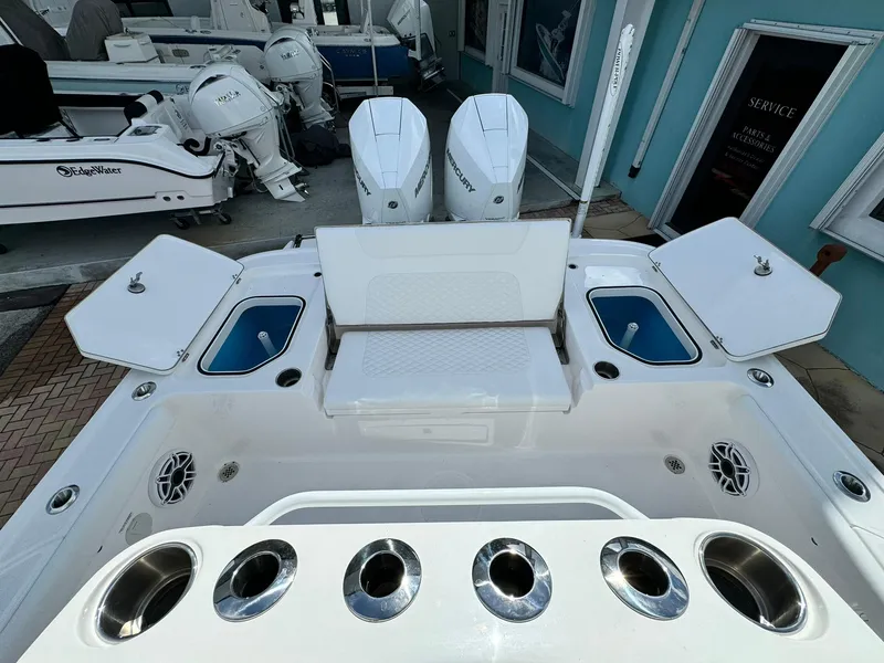 Slide: The Image of 2025 Caymas 281 HB boat with dual engines and spacious deck layout. - 7