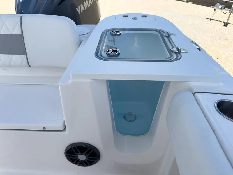 Slide: The Image of 2025 Sea Fox 228 Commander boat with Yamaha engine, featuring a livewell and seating area. - 13