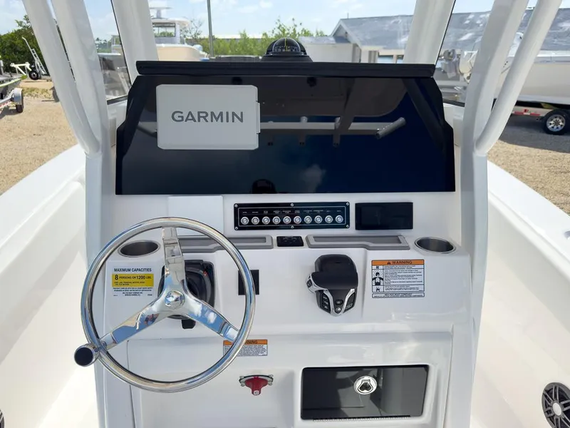Slide: The Image of 2025 Sea Fox 228 Commander boat dashboard with Garmin navigation system. - 14