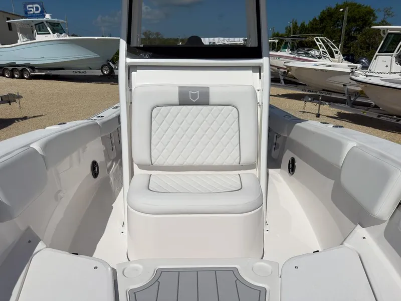 Slide: The Image of 2025 Sea Fox 228 Commander boat interior with white seating and sleek design. - 22