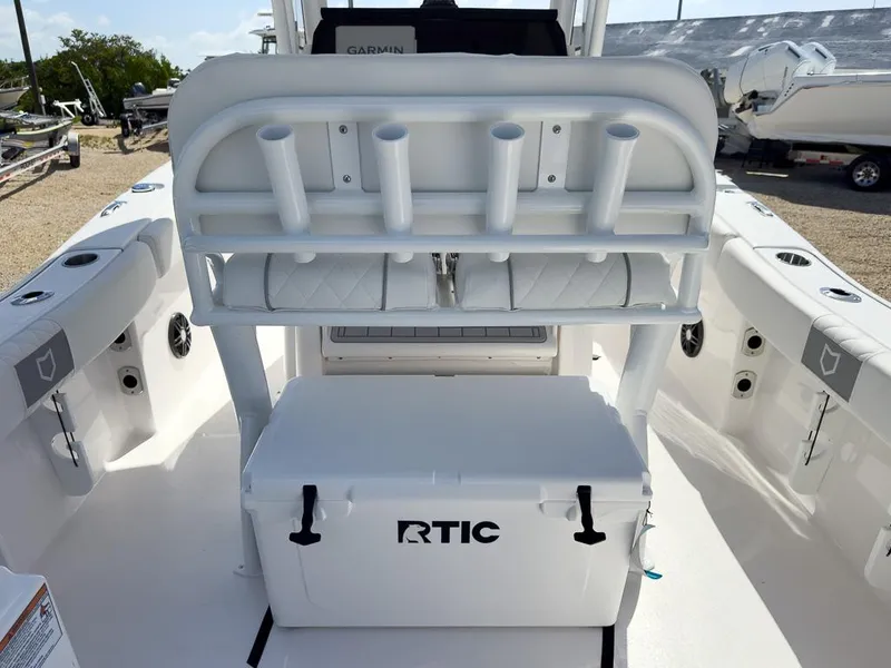 Slide: The Image of 2025 Sea Fox 228 Commander boat interior with RTIC cooler and rod holders. - 9