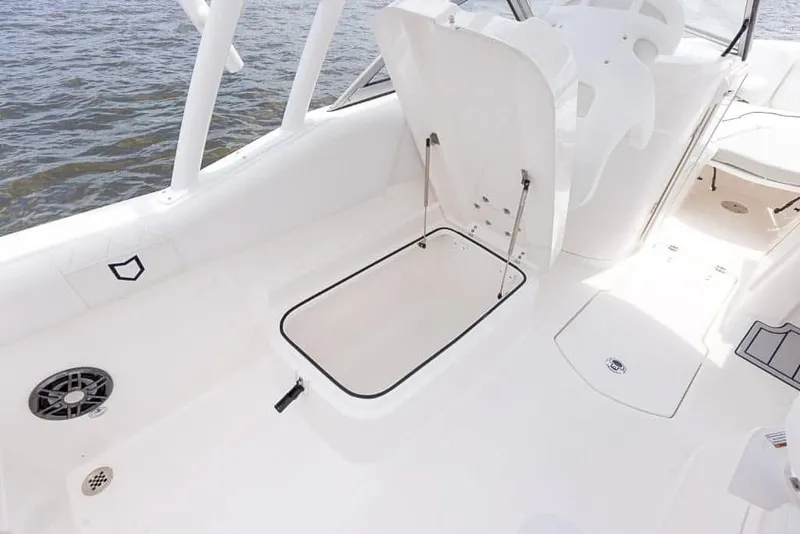 Slide: The Image of 2025 Sea Fox 228 Traveler boat interior with open storage compartment. - 18