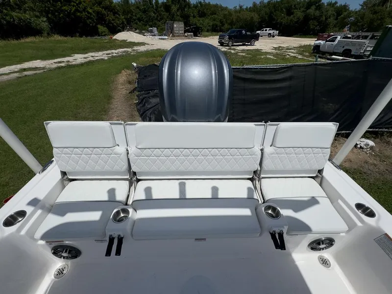 Slide: The Image of 2025 Sea Fox 231 Bay Fox boat with white seating and cup holders. - 15