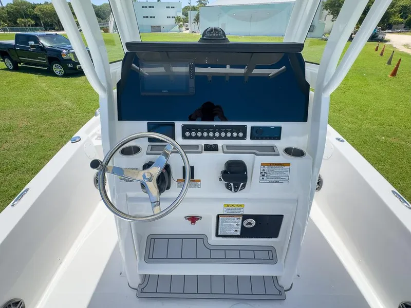 Slide: The Image of 2025 Sea Fox 231 Bay Fox boat console with steering wheel and controls. - 17