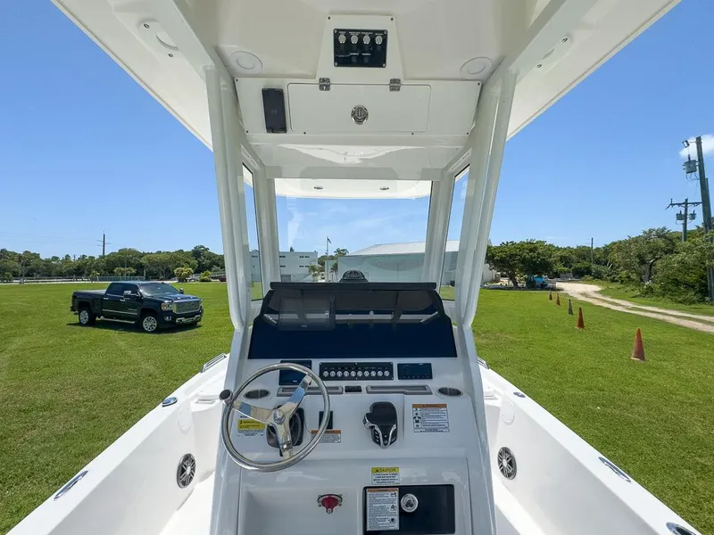 Slide: The Image of 2025 Sea Fox 231 Bay Fox boat console with steering wheel and controls. - 18
