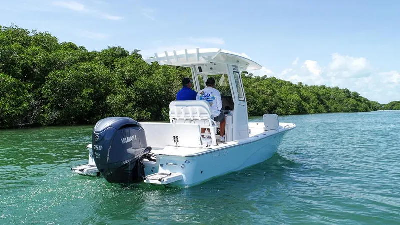 Slide: The Image of 2025 Sea Fox 231 Bay Fox boat cruising on a serene waterway. - 3