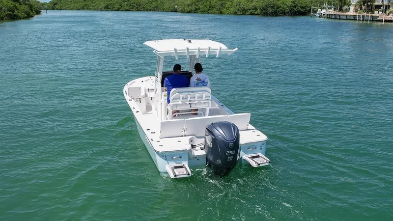 Slide: The Image of 2025 Sea Fox 231 Bay Fox boat cruising on a serene waterway. - 4