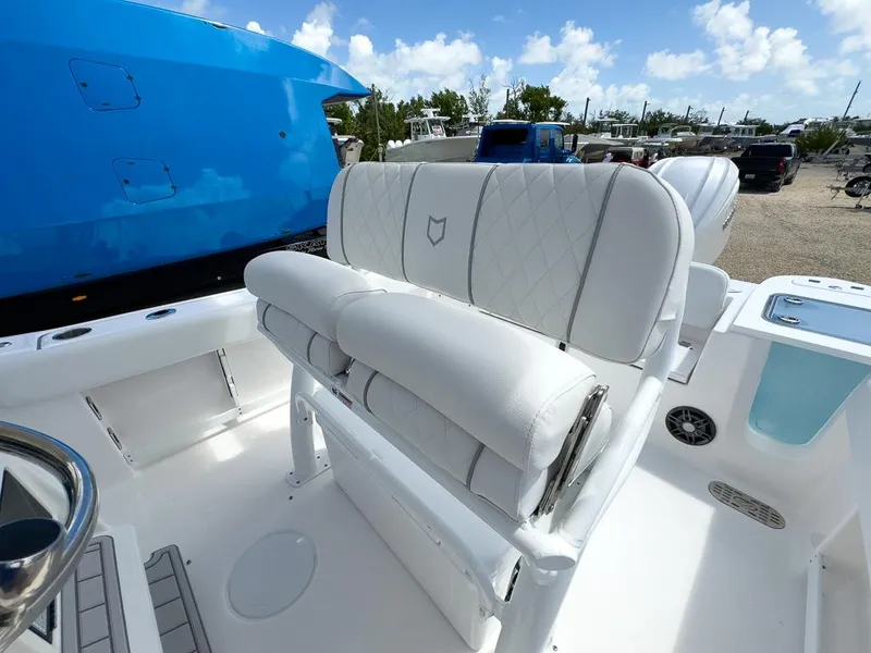 Slide: The Image of 2025 Sea Fox 248 Commander boat interior with white cushioned seating. - 16
