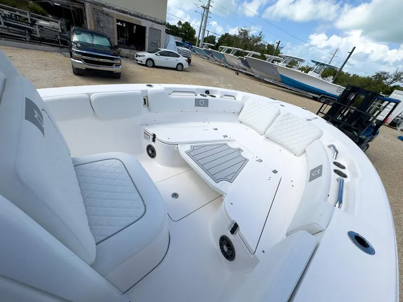 Slide: The Image of 2025 Sea Fox 248 Commander boat interior with white seating and deck. - 17