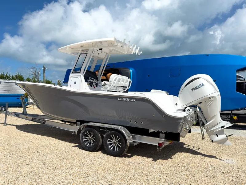 Slide: The Image of 2025 Sea Fox 248 Commander boat with Yamaha engine on trailer. - 2