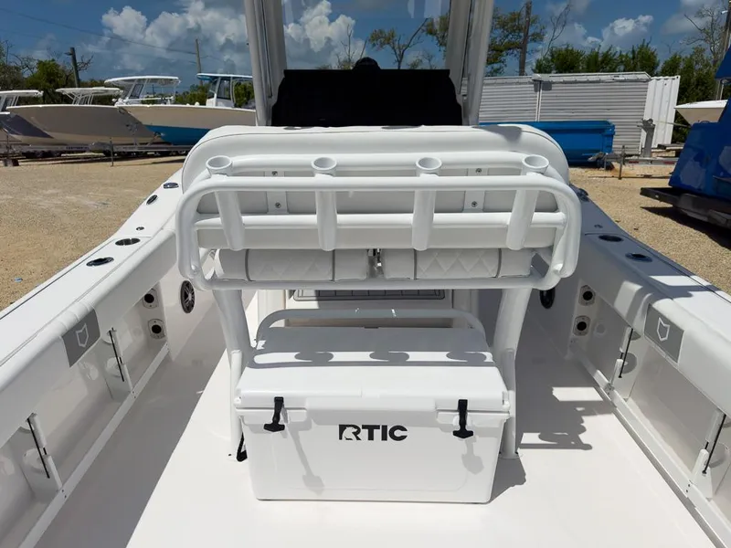 Slide: The Image of 2025 Sea Fox 248 Commander boat interior with RTIC cooler and rod holders. - 7