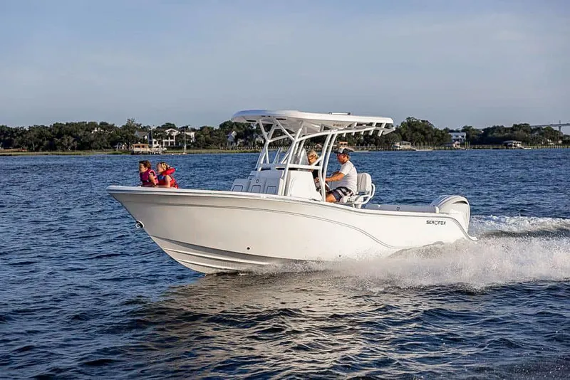 Slide: The Image of 2025 Sea Fox 248 Side Console boat cruising on a sunny day. - 23