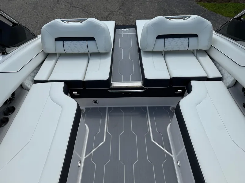 Slide: The Image of 2025 Regal LS4 boat interior with luxurious white seating and modern design. - 10