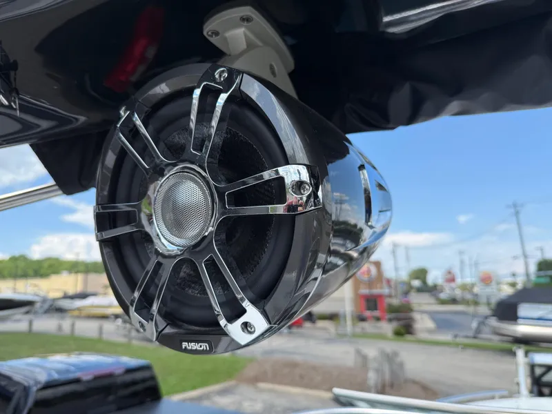 Slide: The Image of Close-up of a Fusion speaker on a 2025 Regal LS4 boat, outdoors. - 12