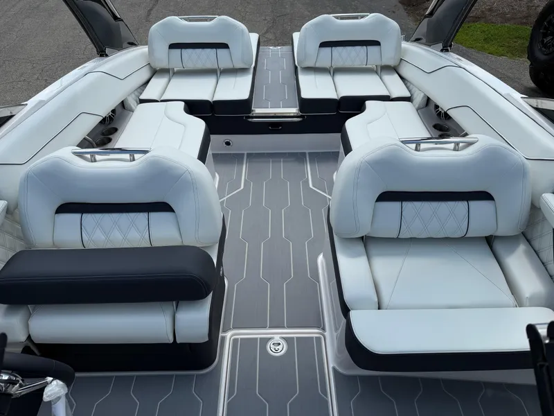 Slide: The Image of 2025 Regal LS4 boat interior with luxurious white seating and modern design. - 3
